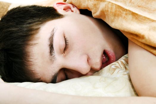 Young Man sound sleeping in the Bed close-up