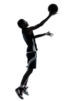 one young man basketball player silhouette in studio isolated on white background