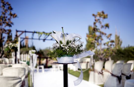 Beautiful ceremony venue with flowers and blue sky