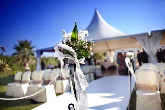 beautiful ceremony venue with flowers and blue sky