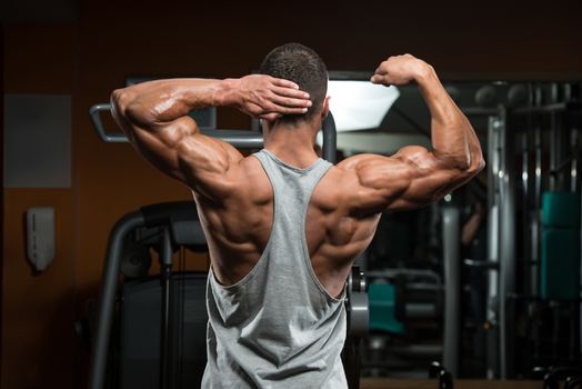 Portrait Of A Physically Fit Young Man - Flexing Muscles