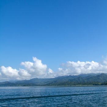 Lake mountain with clouds and blue sky