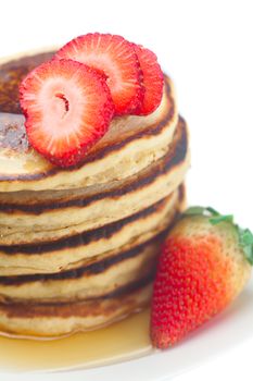 Pancakes, honey and strawberry isolated on white