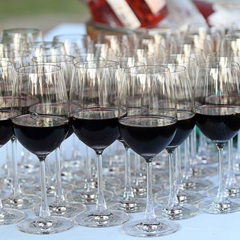 Glass drink red wine in row on table