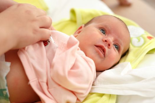 dressing cute baby after bath to pink outfit