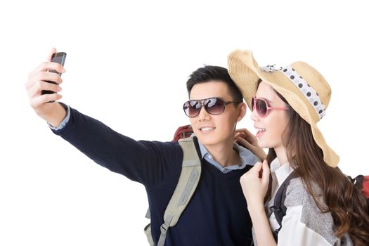 Asian couple travel and take a selfie on white background.
