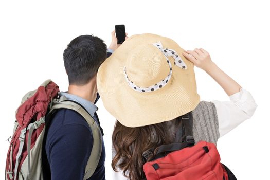 Asian young traveling couple selfie, rear view full length portrait isolated on white background.