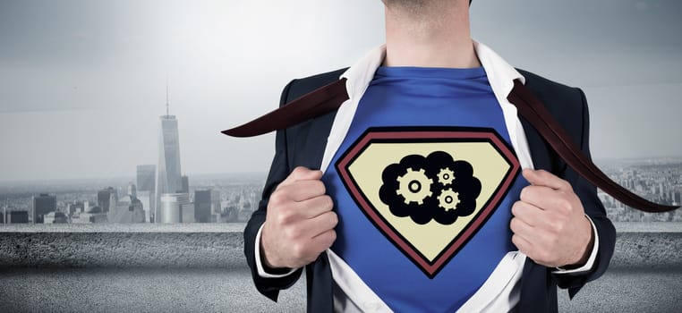 Businessman opening shirt in superhero style against balcony overlooking city