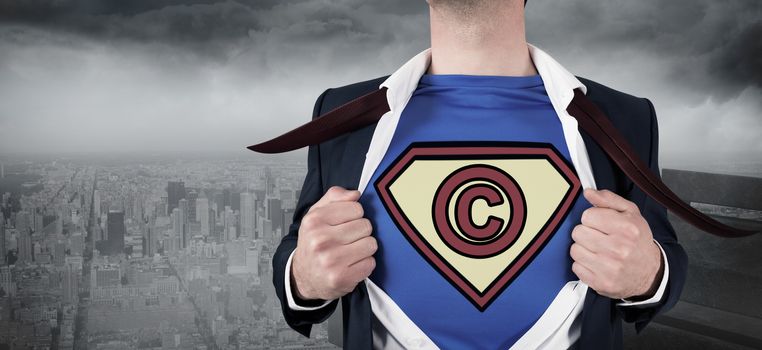 Businessman opening shirt in superhero style against gloomy city