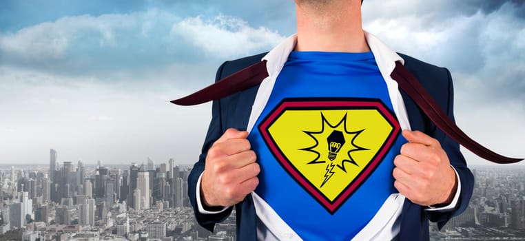 Businessman opening shirt in superhero style against balcony overlooking city