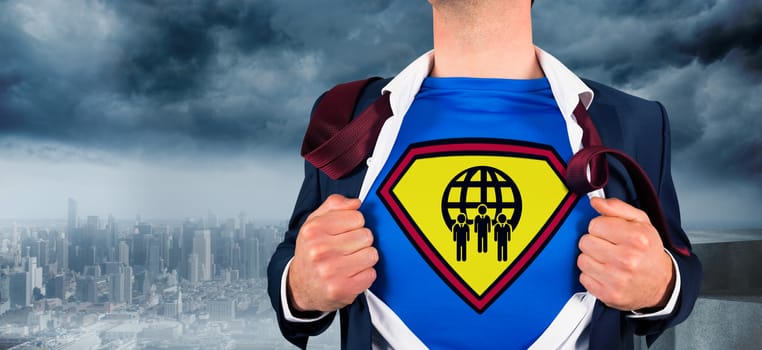 Businessman opening shirt in superhero style against coastline and city