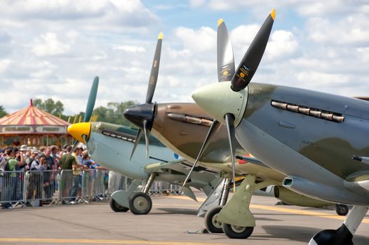 Farnborough, UK - July 24, 2010: Battle of Britain rivals, the  Messerschmitt BF-109, Hurricane and Spitfire lined up together at the Farnborough Airshow, UK