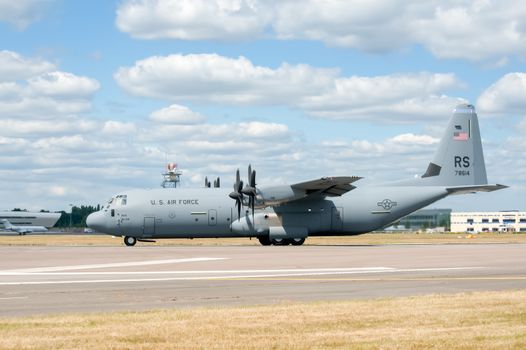 Farnborough, UK - July 24, 2010: USAF C-130J cargo transporter taxiing before take-off at the Farnborough Airshow, UK