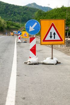 Temporary road construction traffic signs on a road