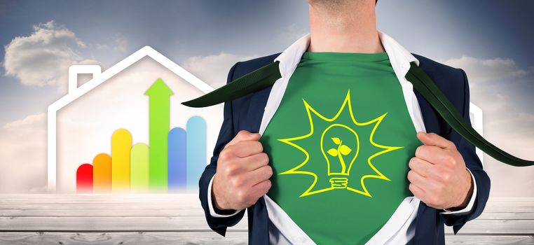 Businessman opening shirt in superhero style against diagram of a house with energy rating chart 