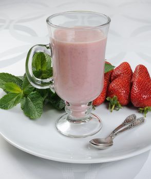 Milkshake of banana and fresh strawberries