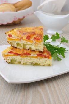 Omelette of zucchini, carrots, tomatoes with cheese