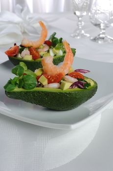 tender appetizer of avocado and shrimp with vegetables