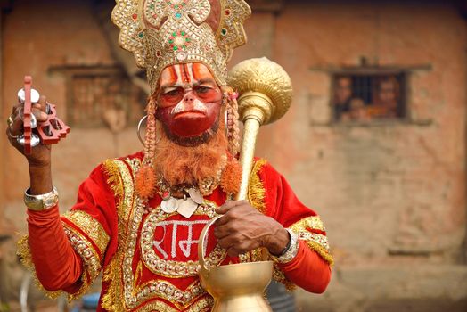 KATHMANDU NEPAL - MARCH 09: Sadhu Hanuman Baba in Pashupatinath on March 09, 2013 in the Pashupatinath Temple, Nepal. Hanuman is a Hindu deity, a central character in the Indian epic Ramayana