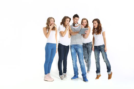 The team of young people three girls and a boy stand on a white background