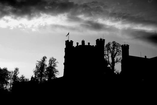 Looking up at a silhouette Hohenschwangau Castle, Germany.