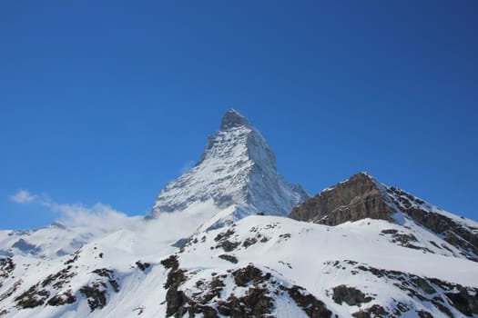 Beautiful snow capped Matterhorn set against a perfectly blue sky
