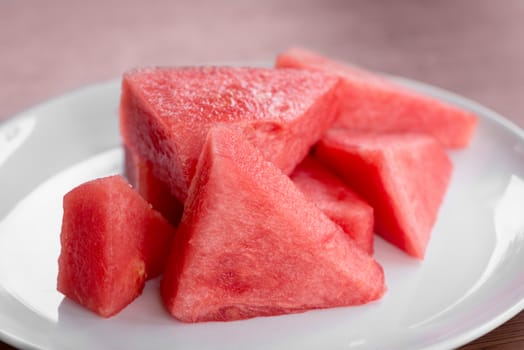 Plate with sliced fresh watermelon without seeds