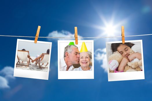 Composite image of instant photos hanging on a line against sunny blue sky