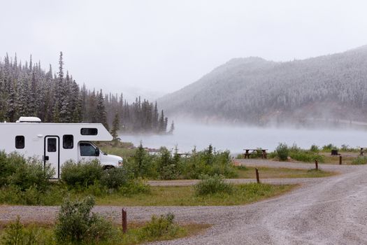Camper van parked on Summit Lake Campground in Stone Mountain Provincial Park, highest point of the Alaska Highway, northern BC, Canada