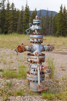 Inoperational oil and gas petroleum industry wellhead flange gear locked shut, Alberta, Canada