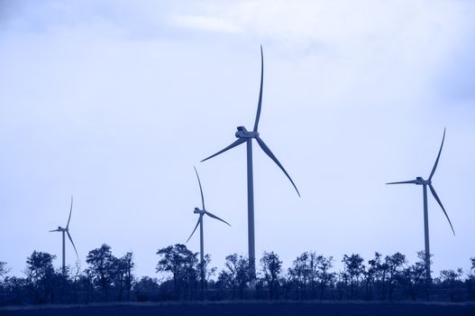 Alternative energy wind turbines. Toned.