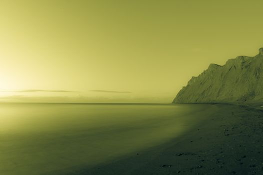 Morning sea. Beach, rocks, sky. Empty, serene landscape. 