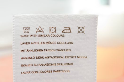 Clothes label with cleaning instructions. Close up.