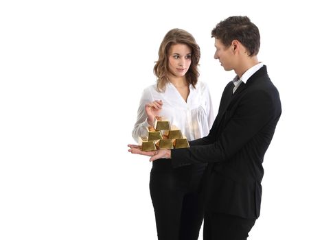 Team of young businessmen in suits official shows a pyramid of gold bars