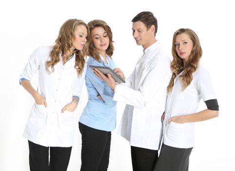 Four young attractive doctors in white, blue aprons on a white background