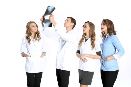 Four young attractive doctors in white, blue aprons on a white background