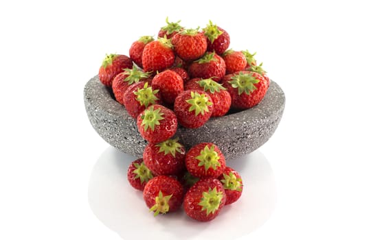 plate with red strawberries isolated on white