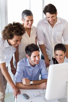 Attractive business people working hard and discussing in the office