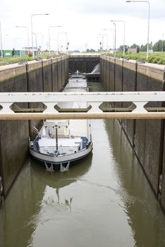 bulk carrier ship in the sluice at the river maas Holland