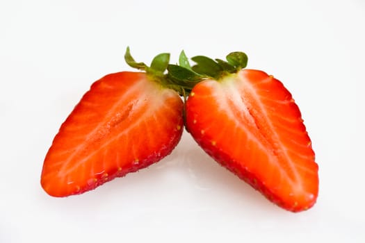 Strawberry halves on a white background