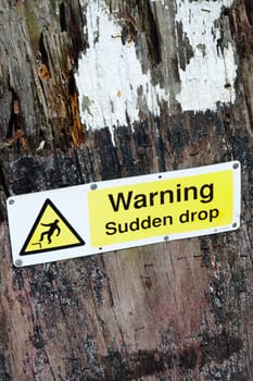 Warning sign for sudden drop