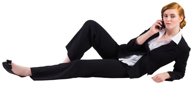 Redhead businesswoman on the phone on white background