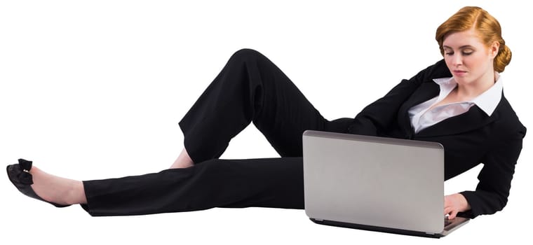 Redhead businesswoman using her laptop on white background