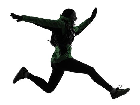 one caucasian woman runner running trekking in silhouette studio isolated on white background