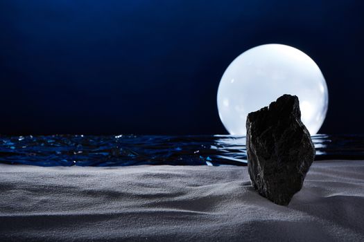 surreal moonset, on the ocean with a  big rock on a white beach.shooted in studio