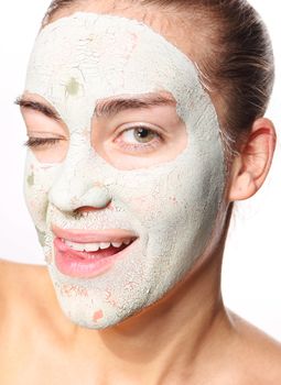 impatient woman in the mask with green clay