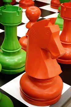 Colorful chess knight is standing on board