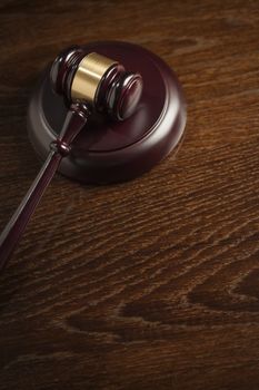 Dark Wooden Gavel Abstract on Table with Room for Text.