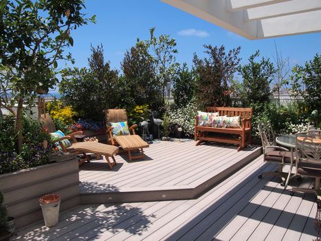 Beautiful classical design blooming rooftop garden in city urban setting