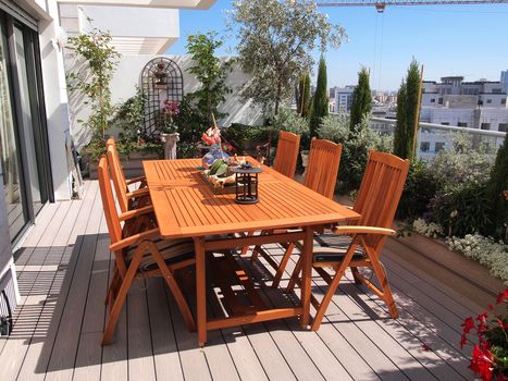 Beautiful classical design blooming rooftop garden in city urban setting